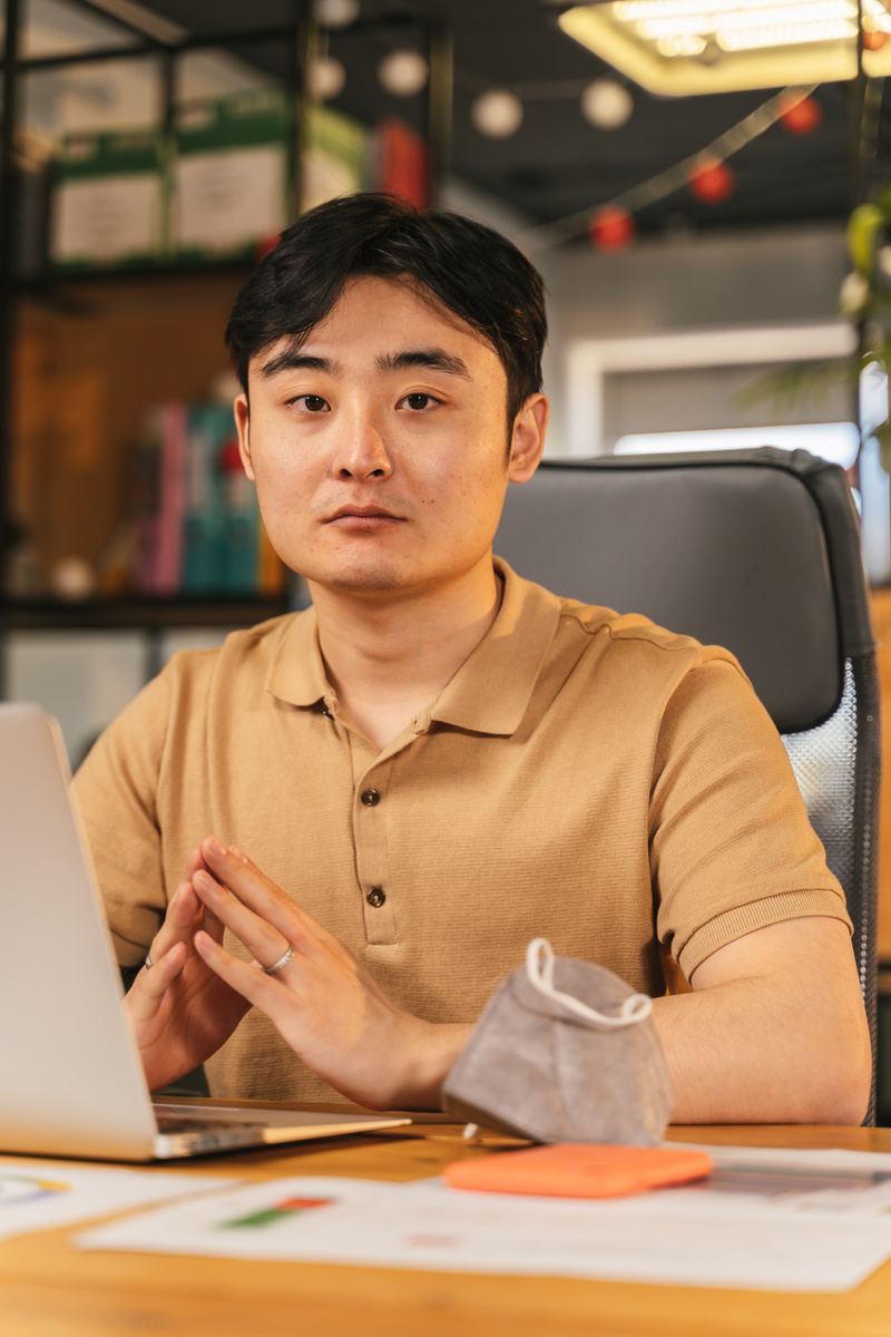 Portrait of a Man in a Brown Polo Shirt